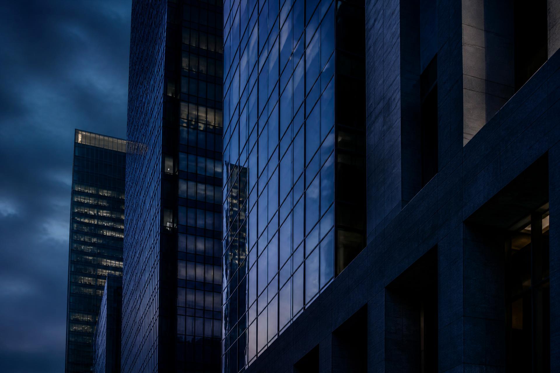 Architectural facade of a financial district tower at dusk